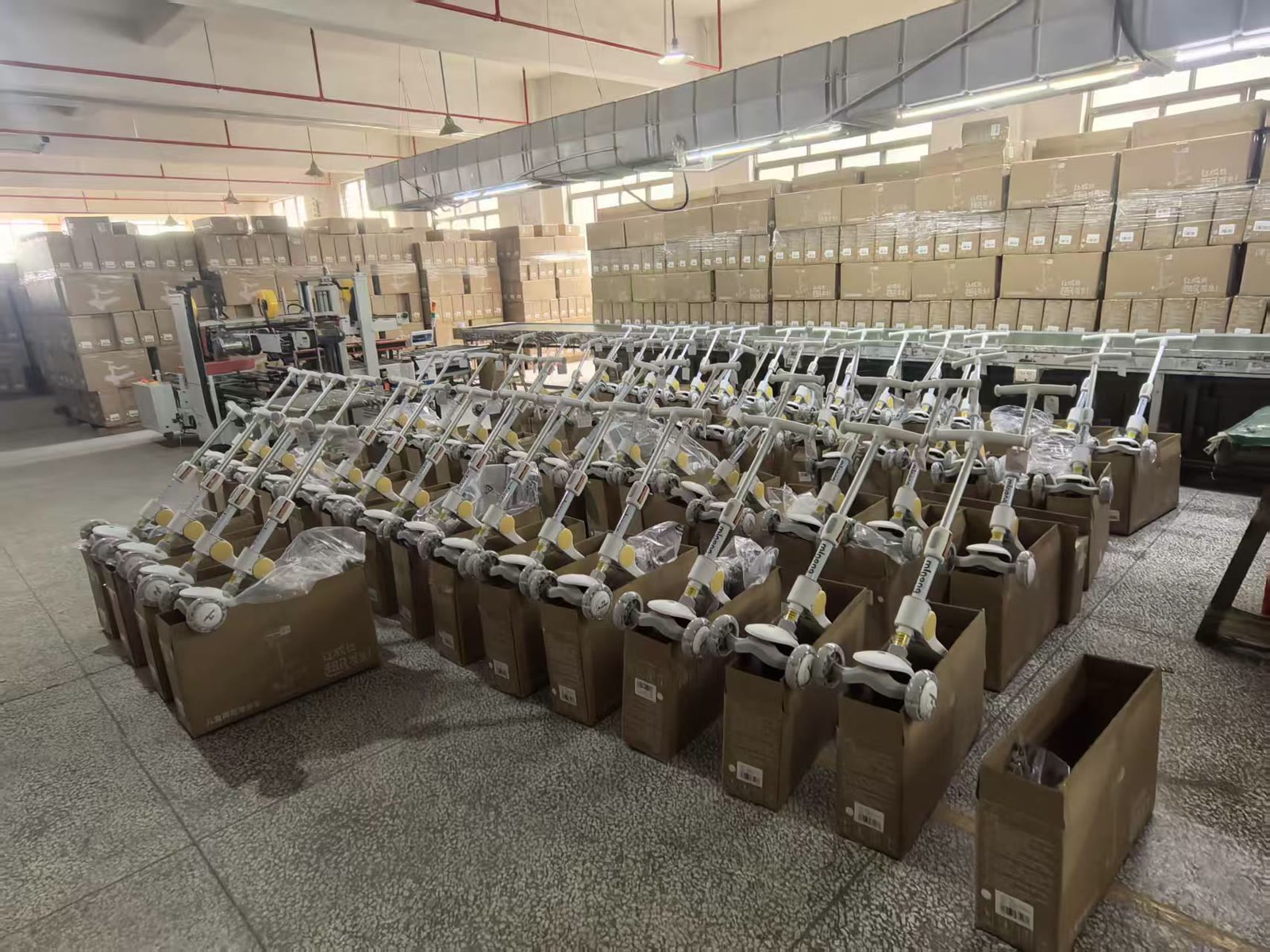 Finished kids scooters arranged for final product inspection and packing