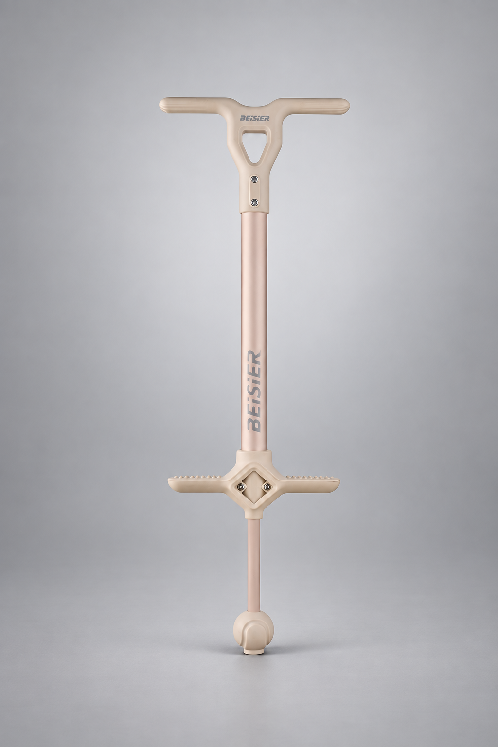 Cream kids pogo stick on a silver-gray studio background