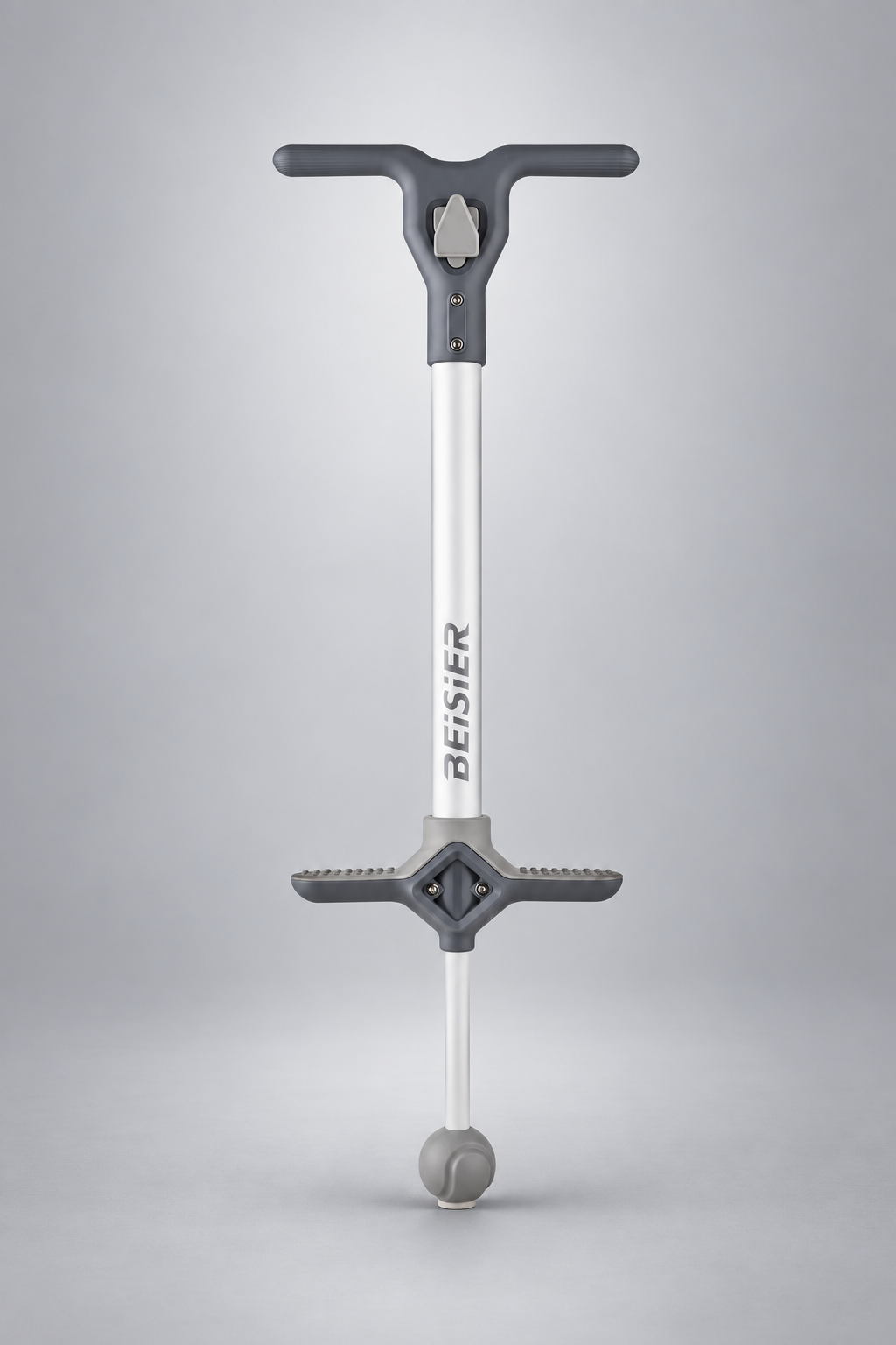 Gray and white kids pogo stick on a silver-gray studio background
